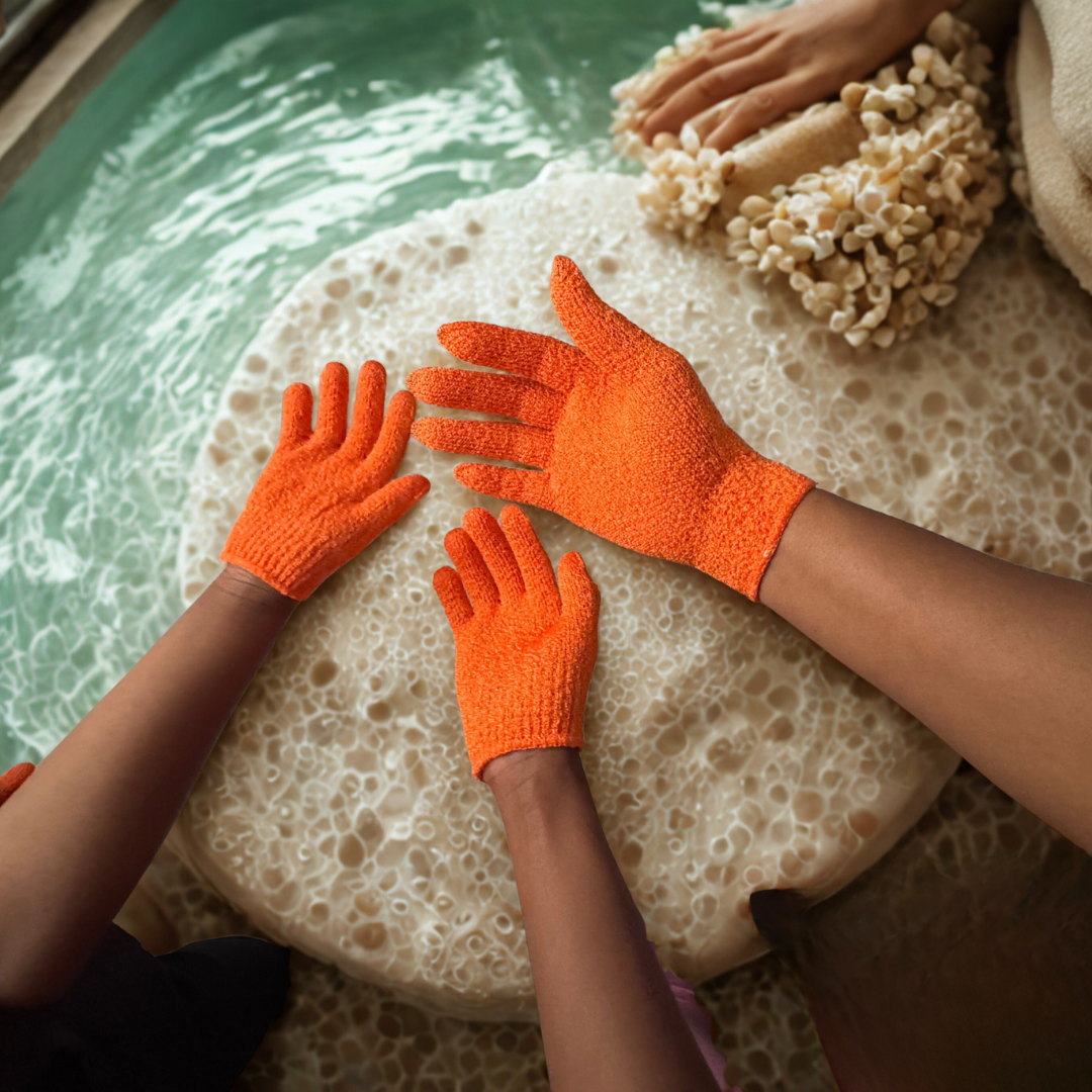 A family wearing Made By Demand orange gloves in a hot tub with water and bubbles.